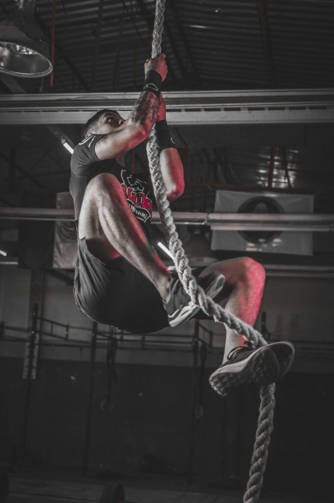 Man climbing on rope